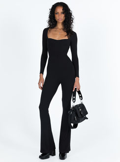 Long sleeve jumpsuit Ribbed material Square neckline Cut out at back with tie fastening Good stretch Partially lined