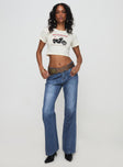 front view of model wearing Princess Polly Leslee Flare Jean Mid Wash Blue Mid Rise 