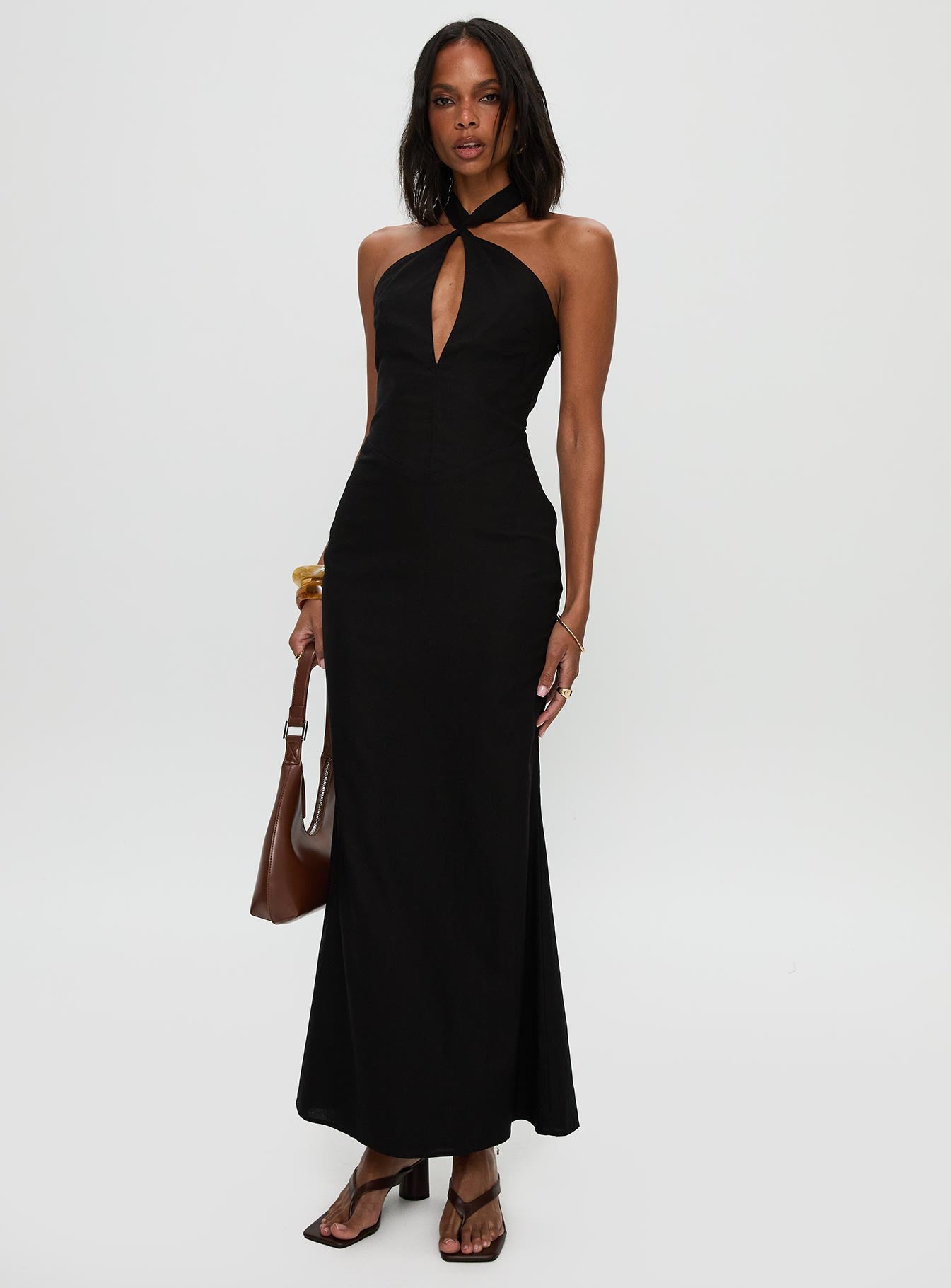 side view of model wearing Princess Polly Rapture Halter Maxi Dress Black Plunger 