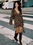 front view of model wearing Princess Polly Raquela Wrap Mini Dress Leopard V-Neck 