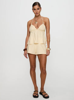 front view of model wearing Princess Polly Solid Gold Shorts Lemon High Waisted Shorts 