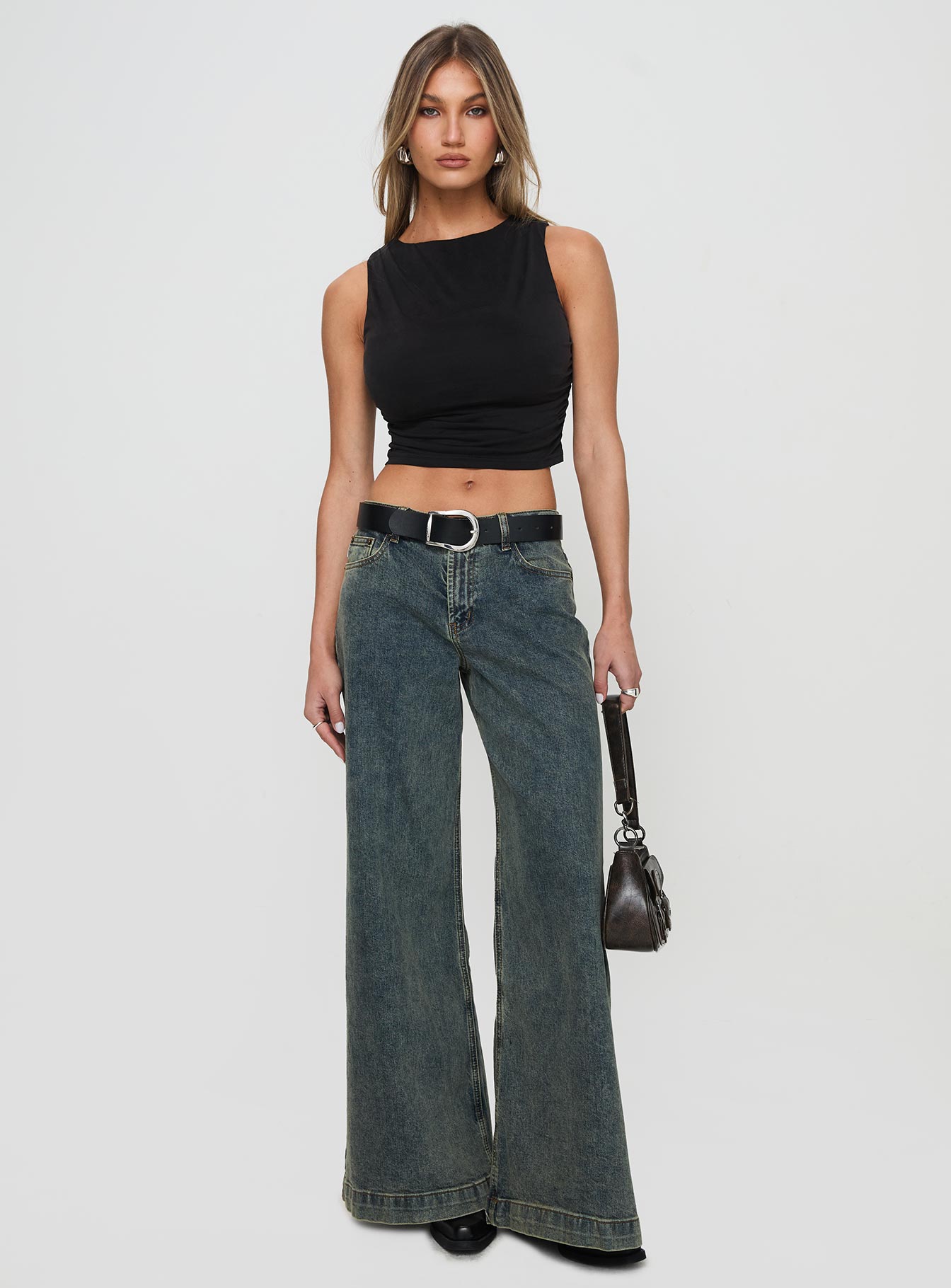 front view of model wearing Princess Polly Hold Em High Neck Top Black Sleeveless High Neck 