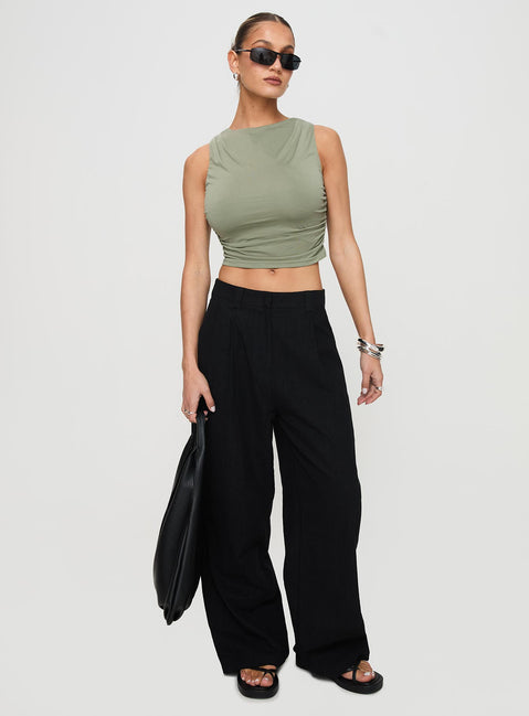 front view of model wearing Princess Polly Hold Em High Neck Top Green Sleeveless Crew Neck 