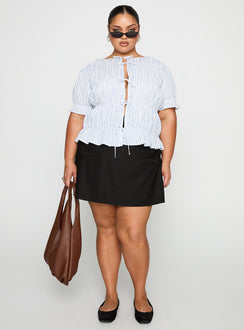 side view of model wearing Princess Polly Alistair Bow Tie Top Blue / White Stripe Curve Half Sleeves Crew Neck 