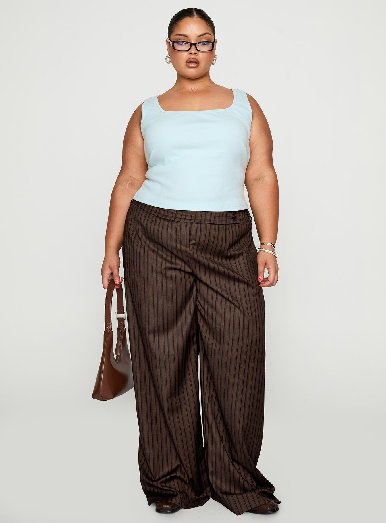 front view of model wearing Princess Polly Cedars Low Rise Pant Brown Stripe Curve Low Rise Pants 