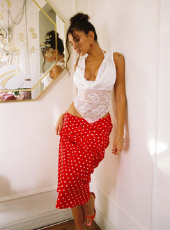   side view of model wearing Princess Polly Hayze Maxi Skirt Red / White Polka Maxi 