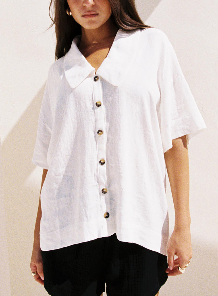 front view of model wearing Princess Polly Goody Linen Button Front Top White Half Sleeves V-Neck 