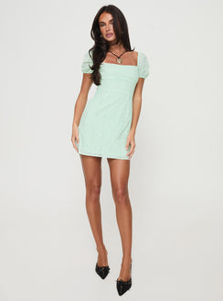 side view of model wearing Princess Polly Havena Anglaise Mini Dress Sage Square Neck 