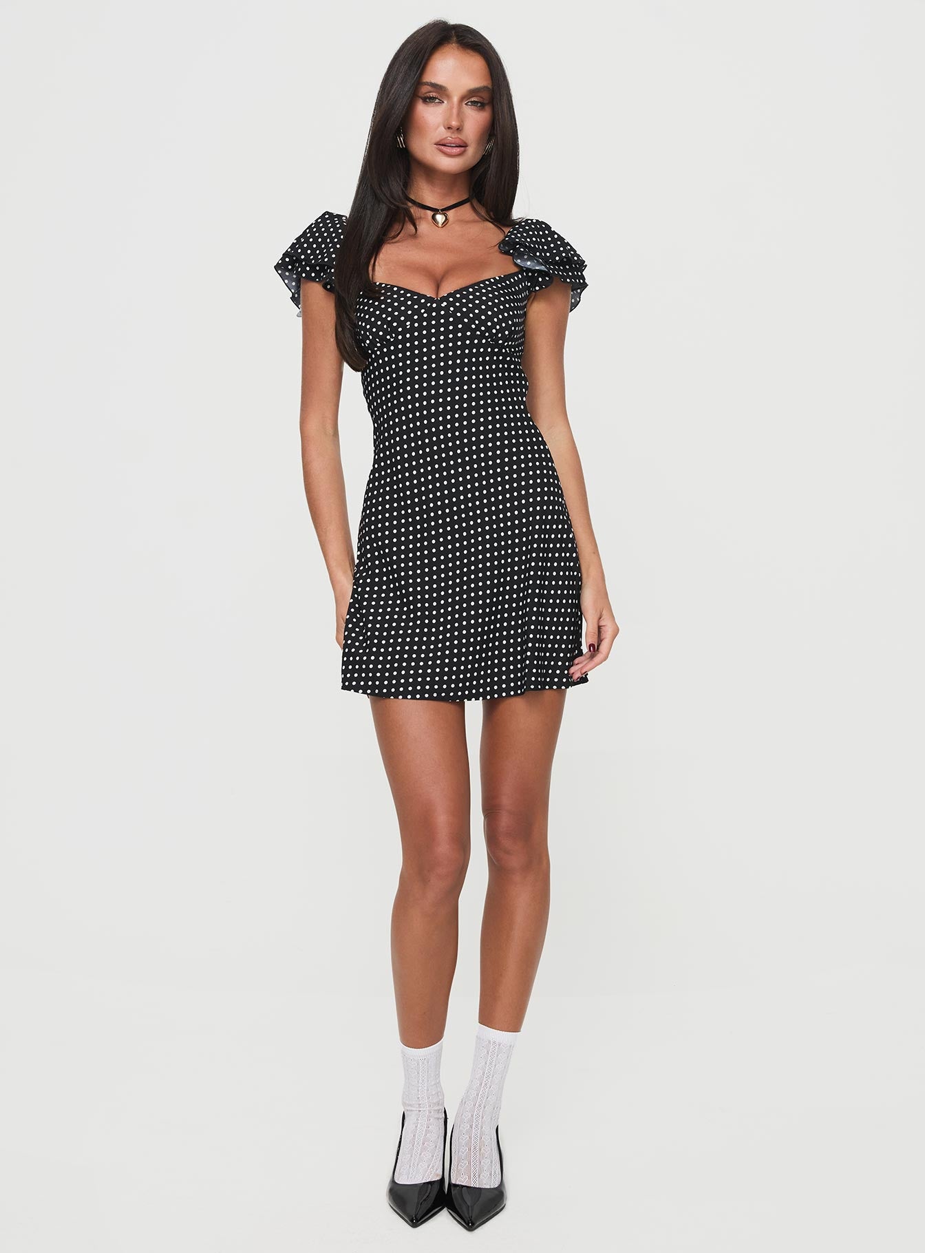 front view of model wearing Princess Polly Moretti Mini Dress Black Polka Dot Sweetheart Neckline 