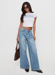 side view of model wearing Princess Polly Ringer Low Rise Wide Leg Jeans Blue Mid Rise 