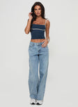 side view of model wearing Princess Polly Serenitia Mid Rise Relaxed Jeans Light Wash Petite Mid Rise 