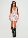 side view of model wearing Princess Polly Karena Mini Dress White / Red Floral Plunger 