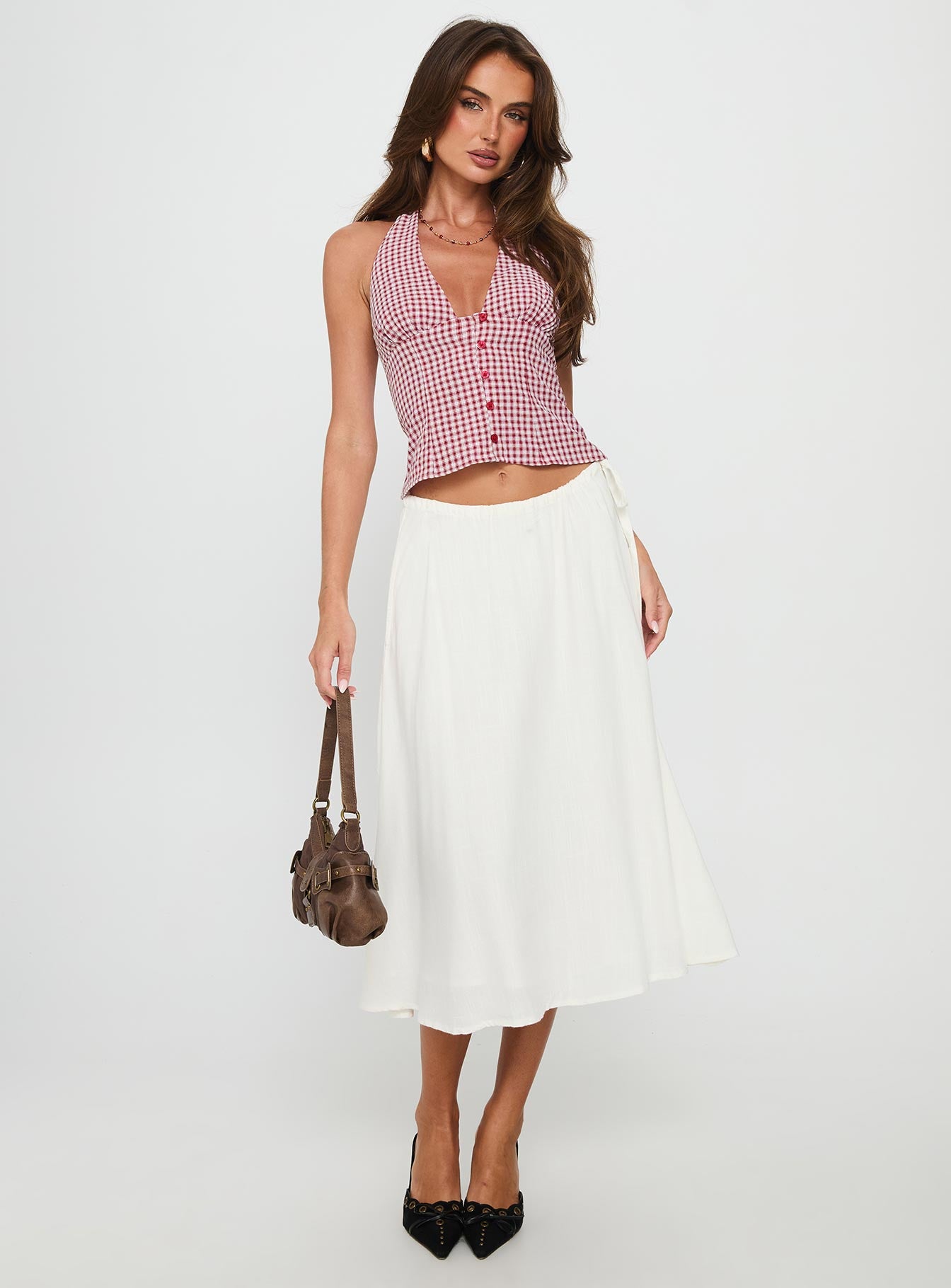   side view of model wearing Princess Polly Persuasion Tie Side Midi Skirt White Midi Skirts 