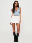 side view of model wearing Princess Polly Gigi Skort White Lower Impact High Waisted Shorts 