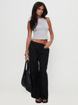 side view of model wearing Princess Polly Sallon Low Rise Pants Black Low Rise Pants 