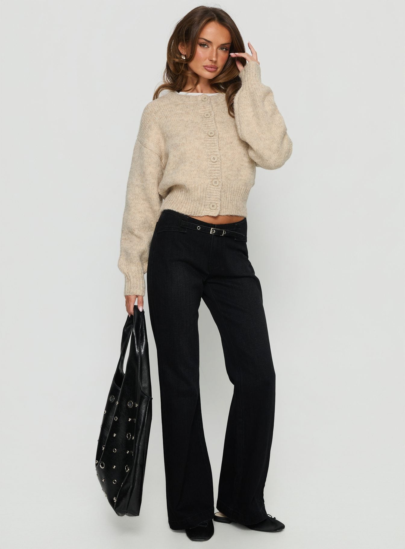 side view of model wearing Princess Polly Slow Ride Mid Rise Bootleg Belted Jeans Washed Black Mid Rise Jeans 