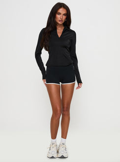 front view of model wearing Princess Polly Celosiah Zip Up Collared Top Black Full Sleeves V-Neck 