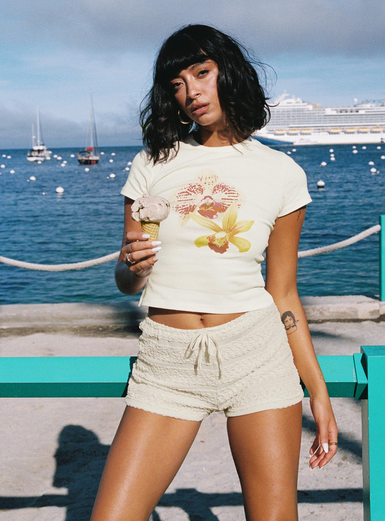 front view of model wearing Princess Polly Blooming Orchids Graphic Top Cream Short Sleeves Crew Neck 