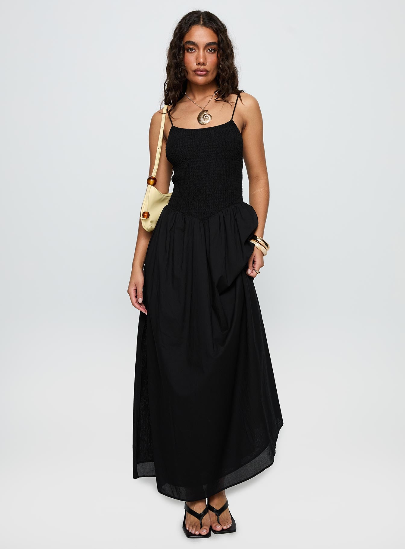 side view of model wearing Princess Polly Carys Maxi Dress Black Square Neck 