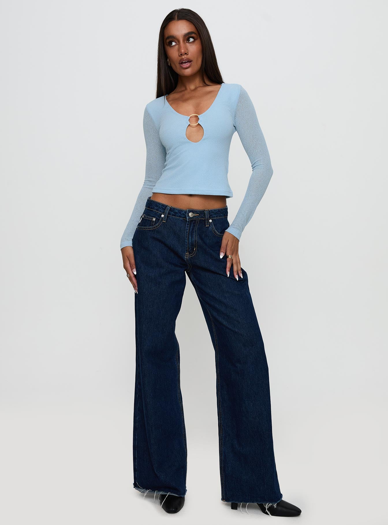 side view of model wearing Princess Polly This Fate Long Sleeve Ring Detail Top Blue Full Sleeves Scoop Neck 