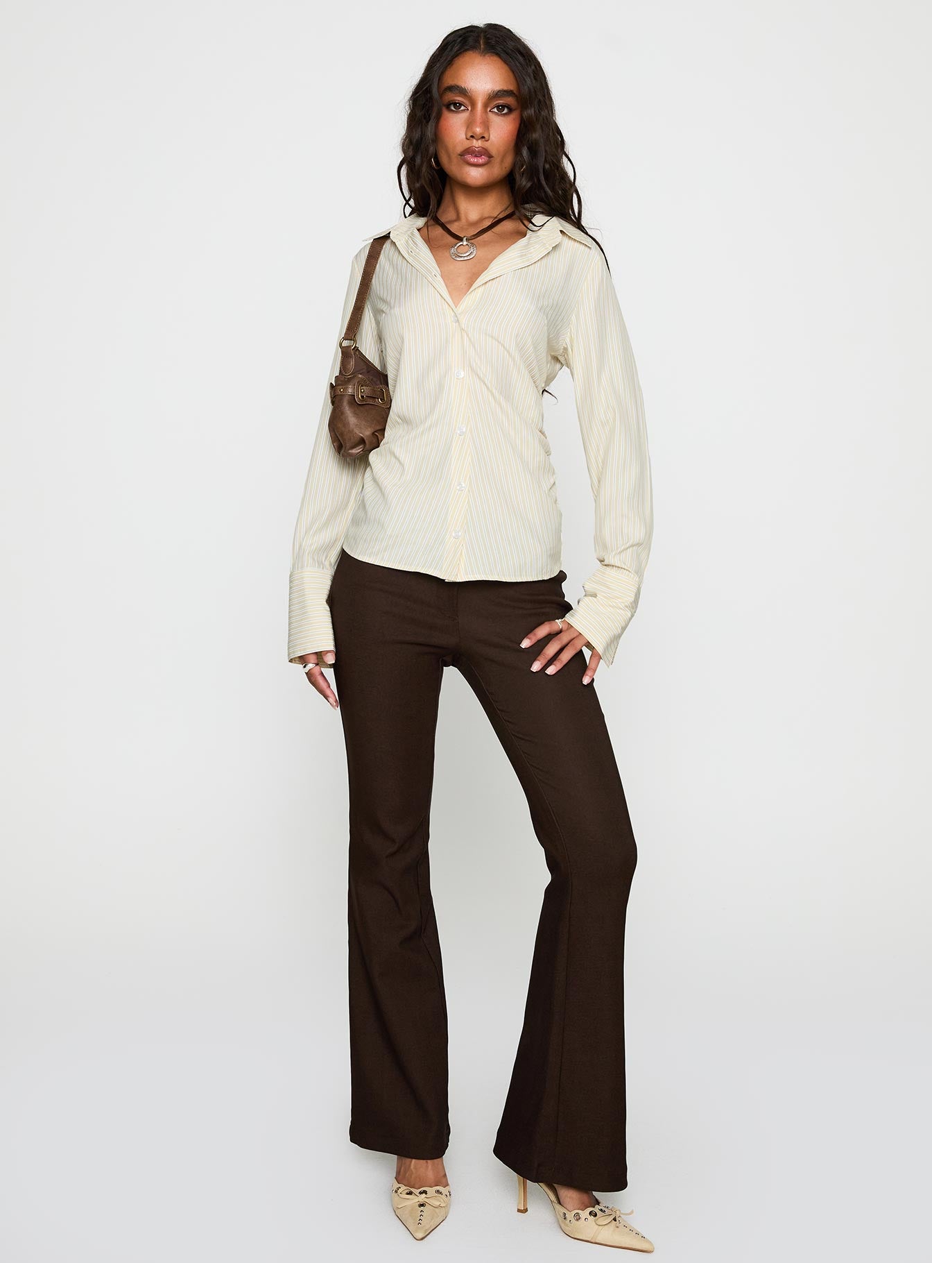 side view of model wearing Princess Polly Rush Hour Long Sleeve Top Yellow Stripe Full Sleeves V-Neck 