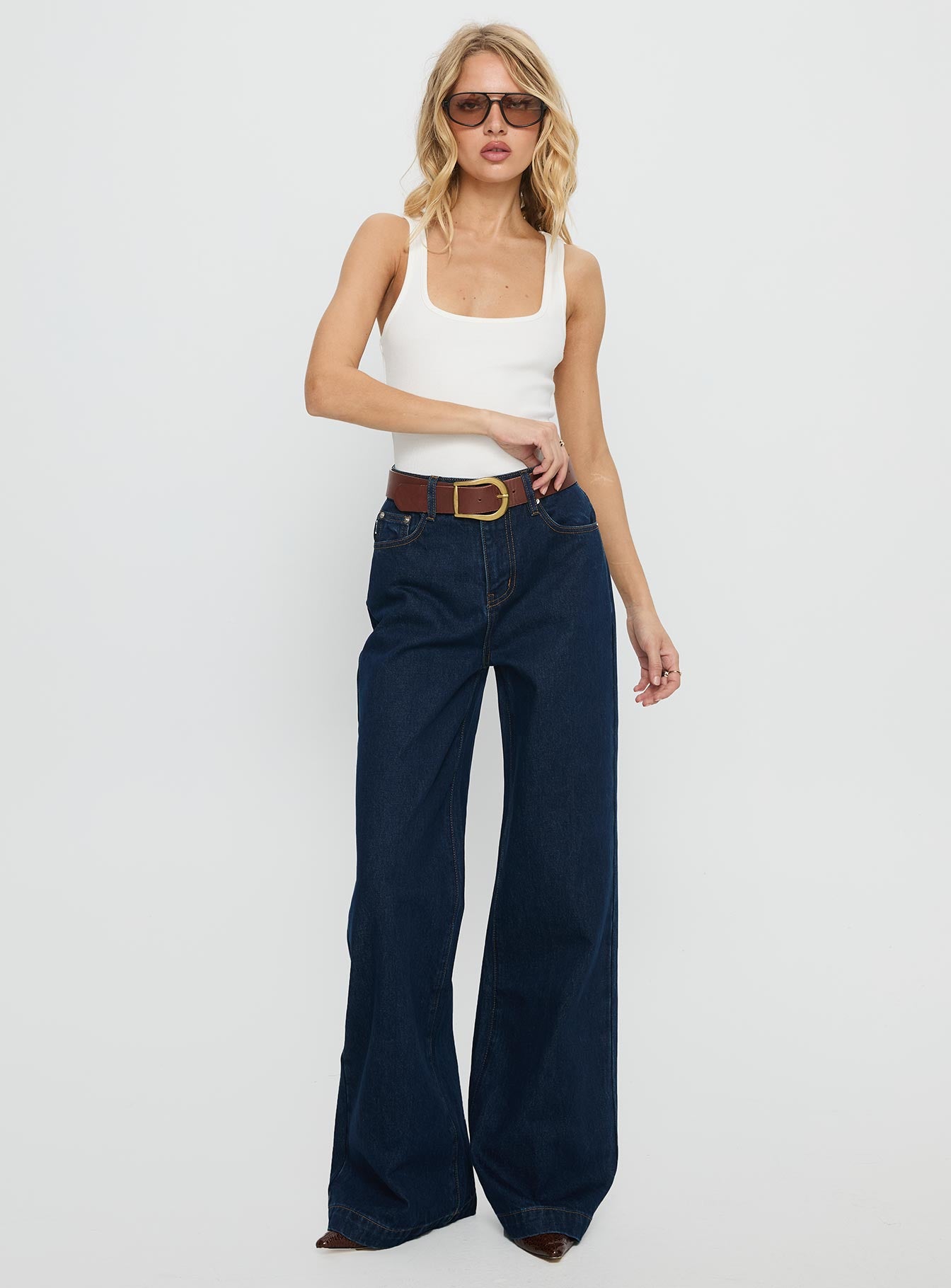 front view of model wearing Princess Polly Goldie High Rise Wide Leg Jeans Indigo High Rise Jeans 