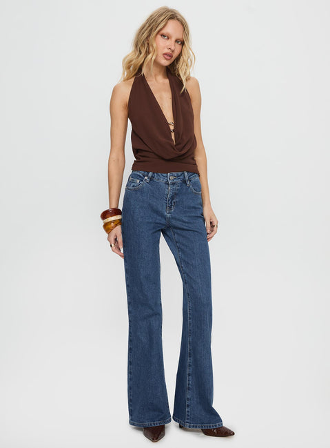 side view of model wearing Princess Polly Magic Mirror Mid Rise Bootleg Jeans Mid Blue Wash Mid Rise Jeans 