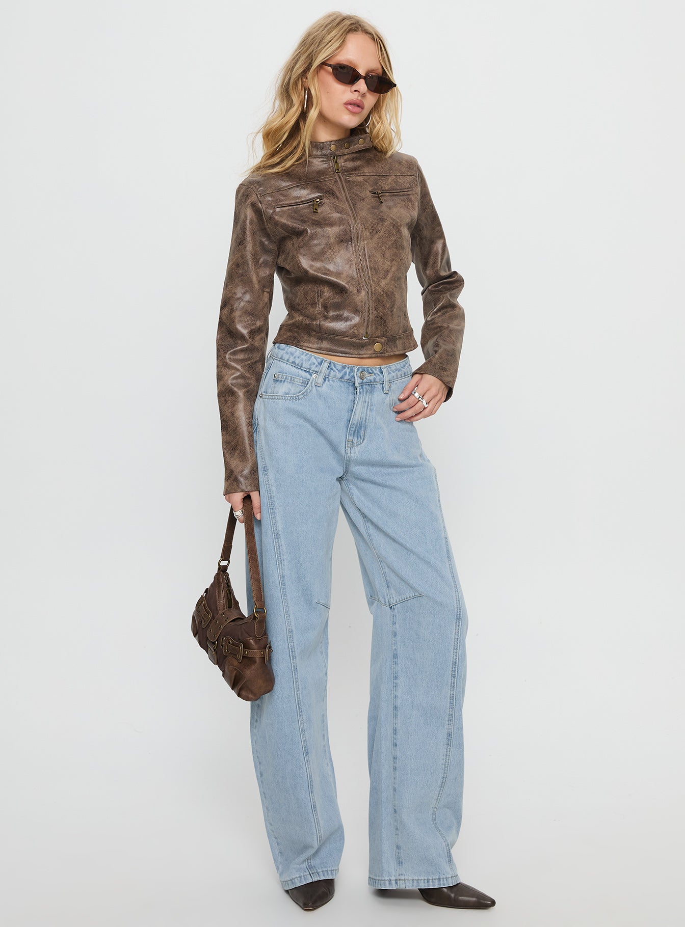 side view of model wearing Princess Polly Lost Track Mid Rise Barrel Leg Jeans Ice Wash Mid Rise Jeans 