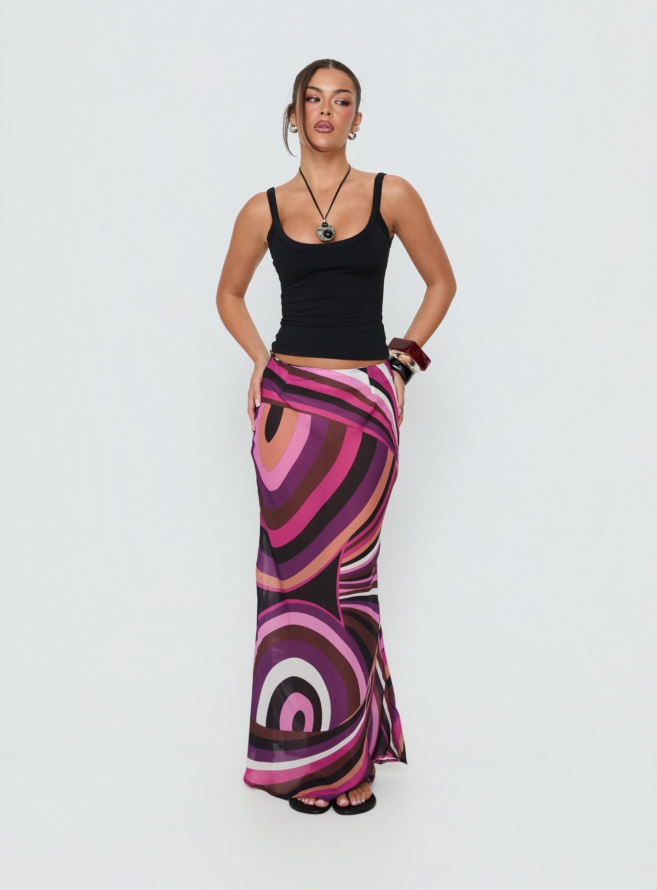 Introducing the Lucidia Maxi Skirt Pink Retro in womens-skirts featuring maxi length side view of model wearing Princess Polly