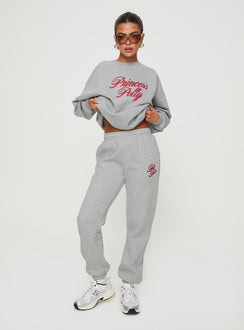 front view of model wearing Princess Polly Princess Polly Track Pants Cursive Text Grey Marle/ Red High Waisted Pants 