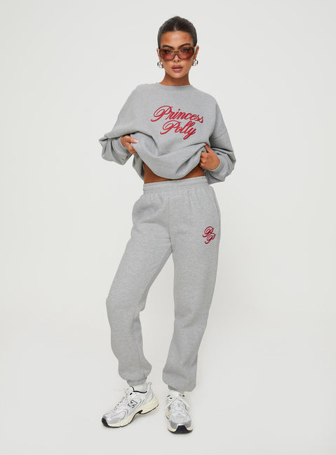 front view of model wearing Princess Polly Princess Polly Track Pants Cursive Text Grey Marle/ Red High Waisted Pants 
