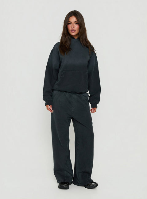 Crafted from black Baggy Sweatpant in womens regular pants with wide-leg mid-rise design front view of model wearing Princess Polly