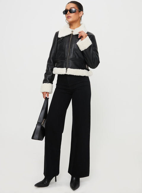 Jacket Faux leather, shearling material on inside and outside, classic collar, twin chest pockets, twin buckle detail at sides-adjustable Zip fastening at front