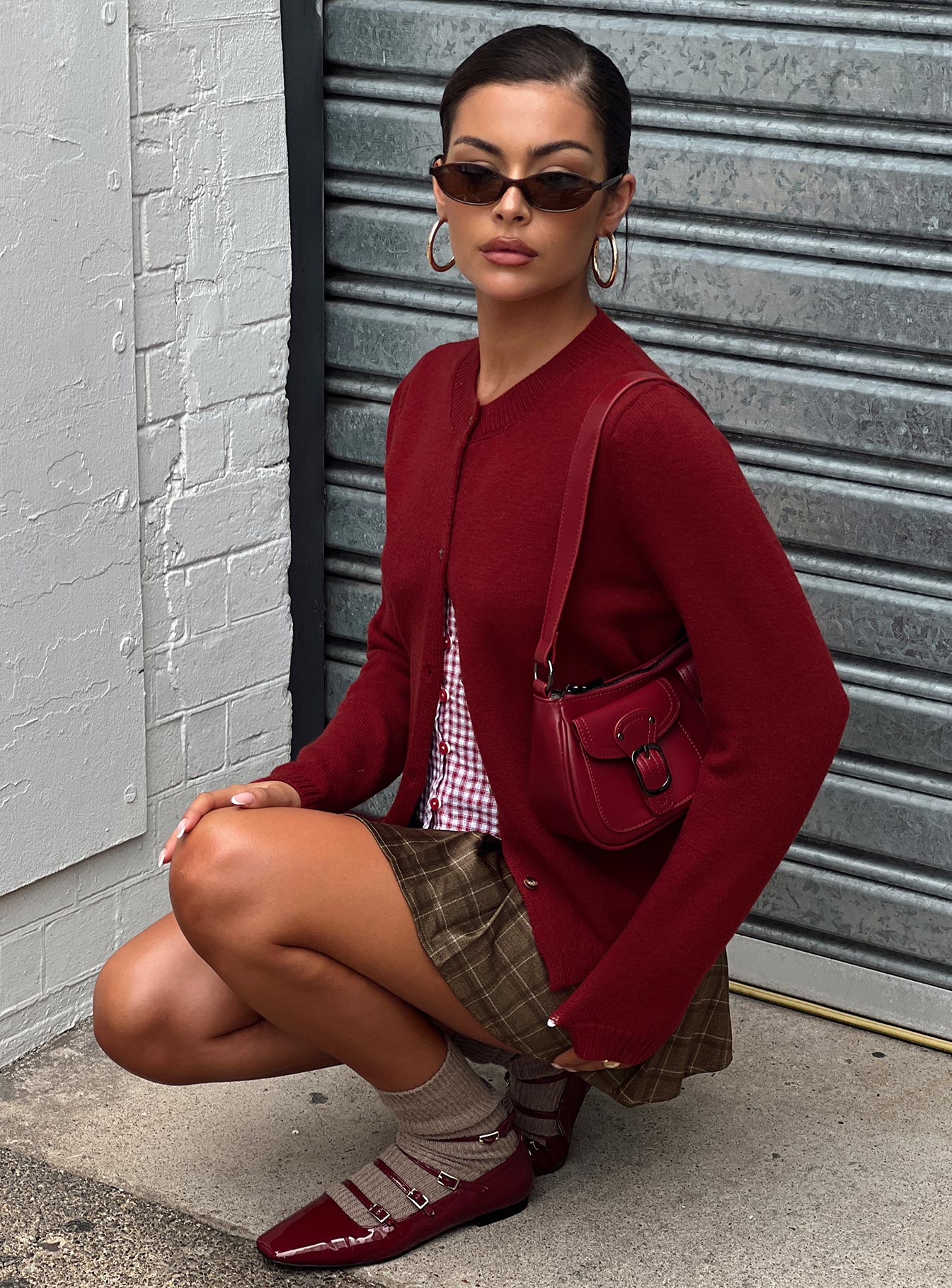 side view of model wearing Princess Polly Arica Button Up Knit Cardigan Red Long 
