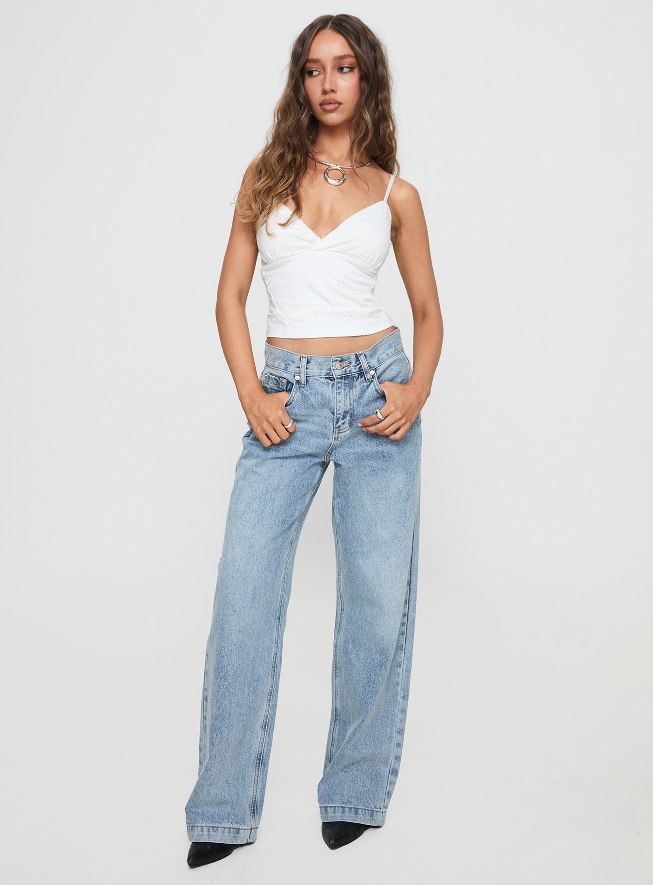 front view of model wearing Princess Polly Anelli Low Rise Straight Leg Jeans Light Blue Wash High Waisted 