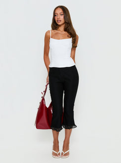 back view of model wearing Princess Polly Darsie Frill Capri Black Polka Dot High Rise Pants 