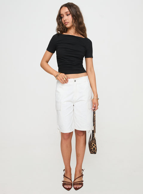 side view of model wearing Princess Polly Peyson Top Black Short Sleeves Scoop Neck 