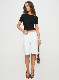 front view of model wearing Princess Polly Bleachers Shorts White High Waisted Shorts 