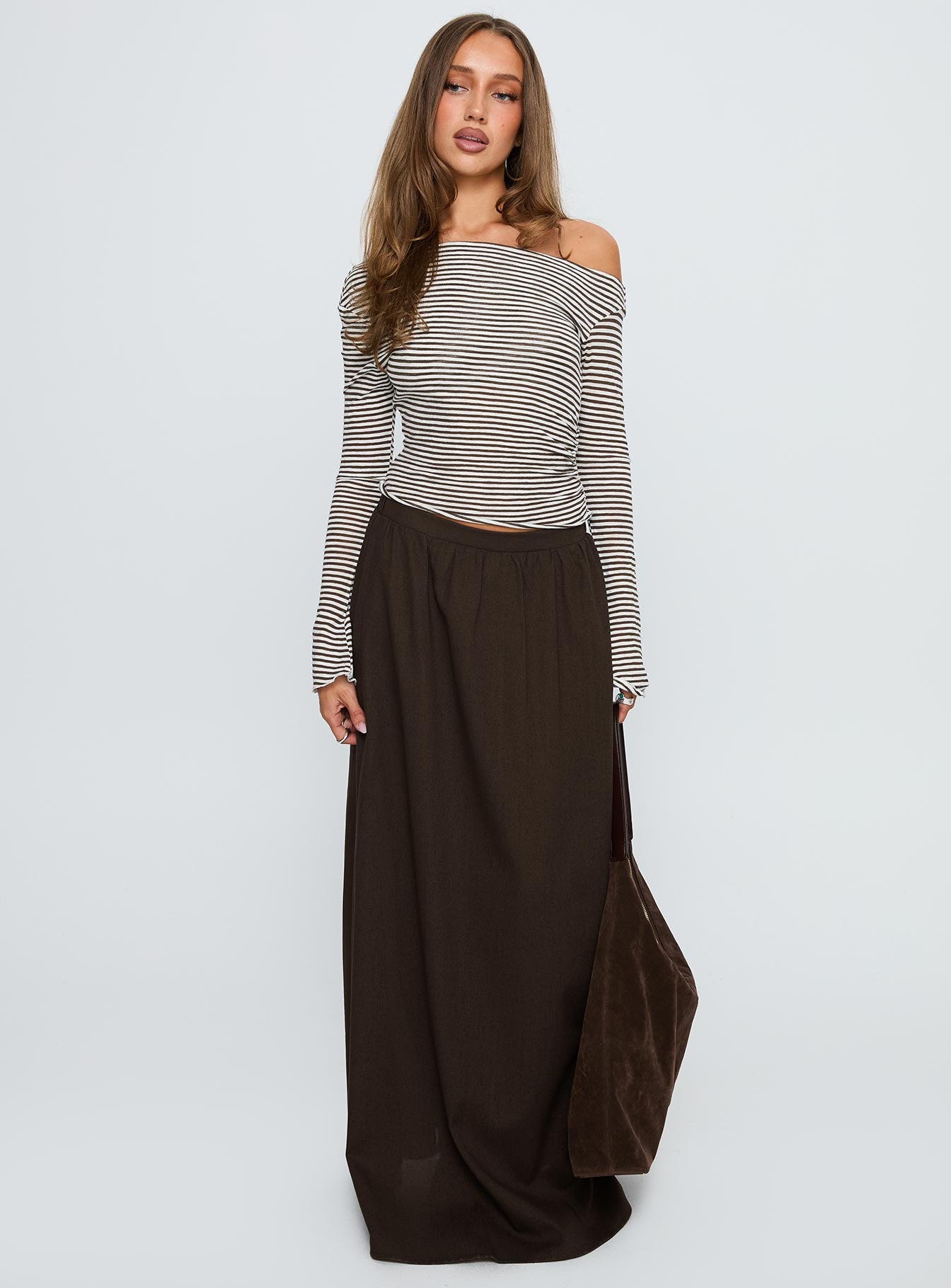   side view of model wearing Princess Polly Hallee Maxi Skirt Brown Maxi 