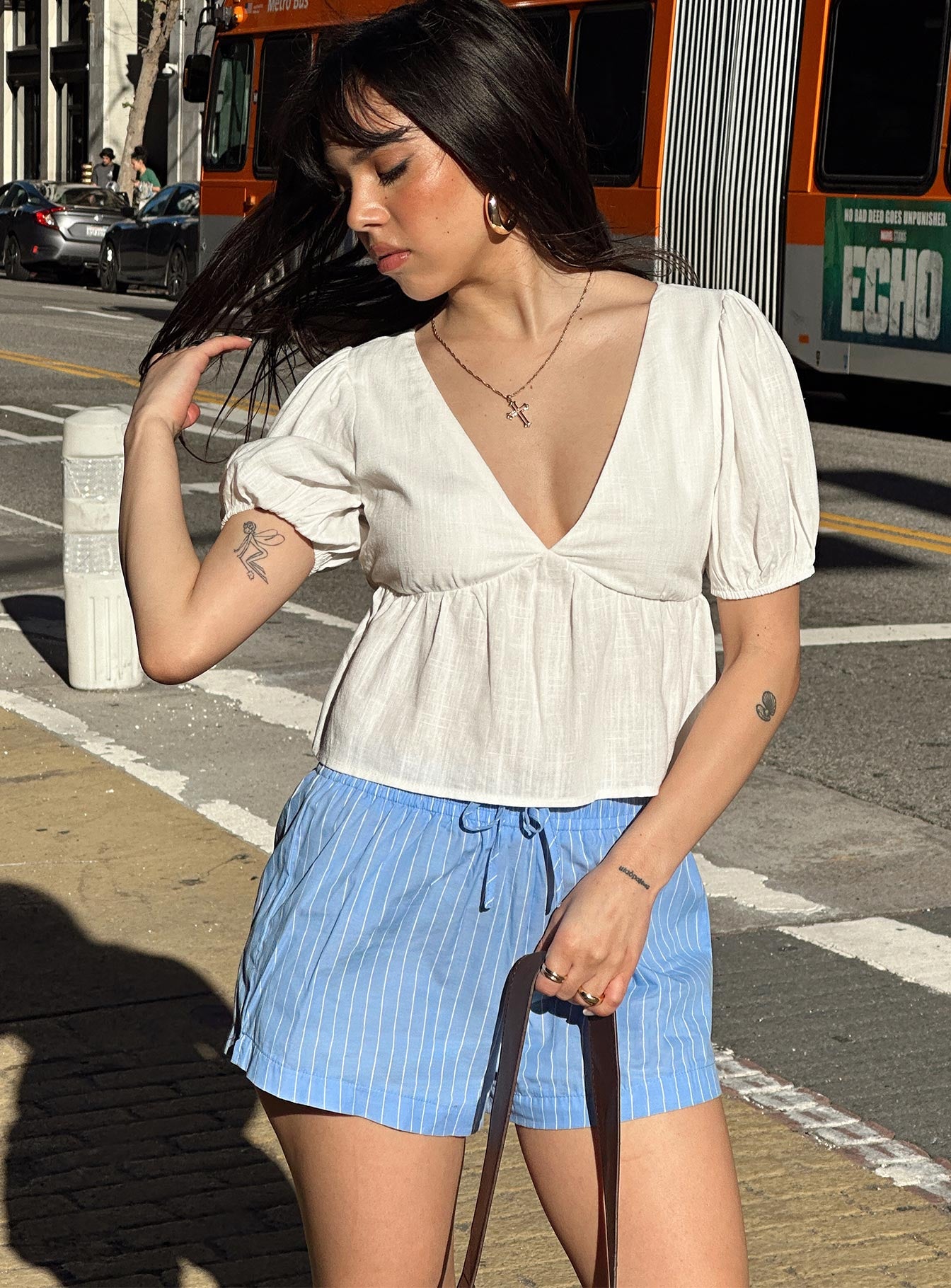 front view of model wearing Princess Polly Maxxy Boxer Shorts Blue Stripe High Waisted Shorts 