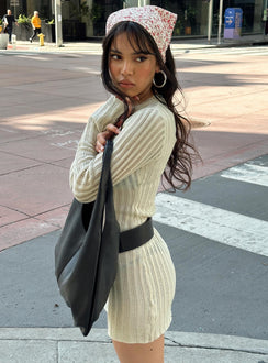 side view of model wearing Princess Polly Primmie Long Sleeve Mini Dress Cream Crew Neck 