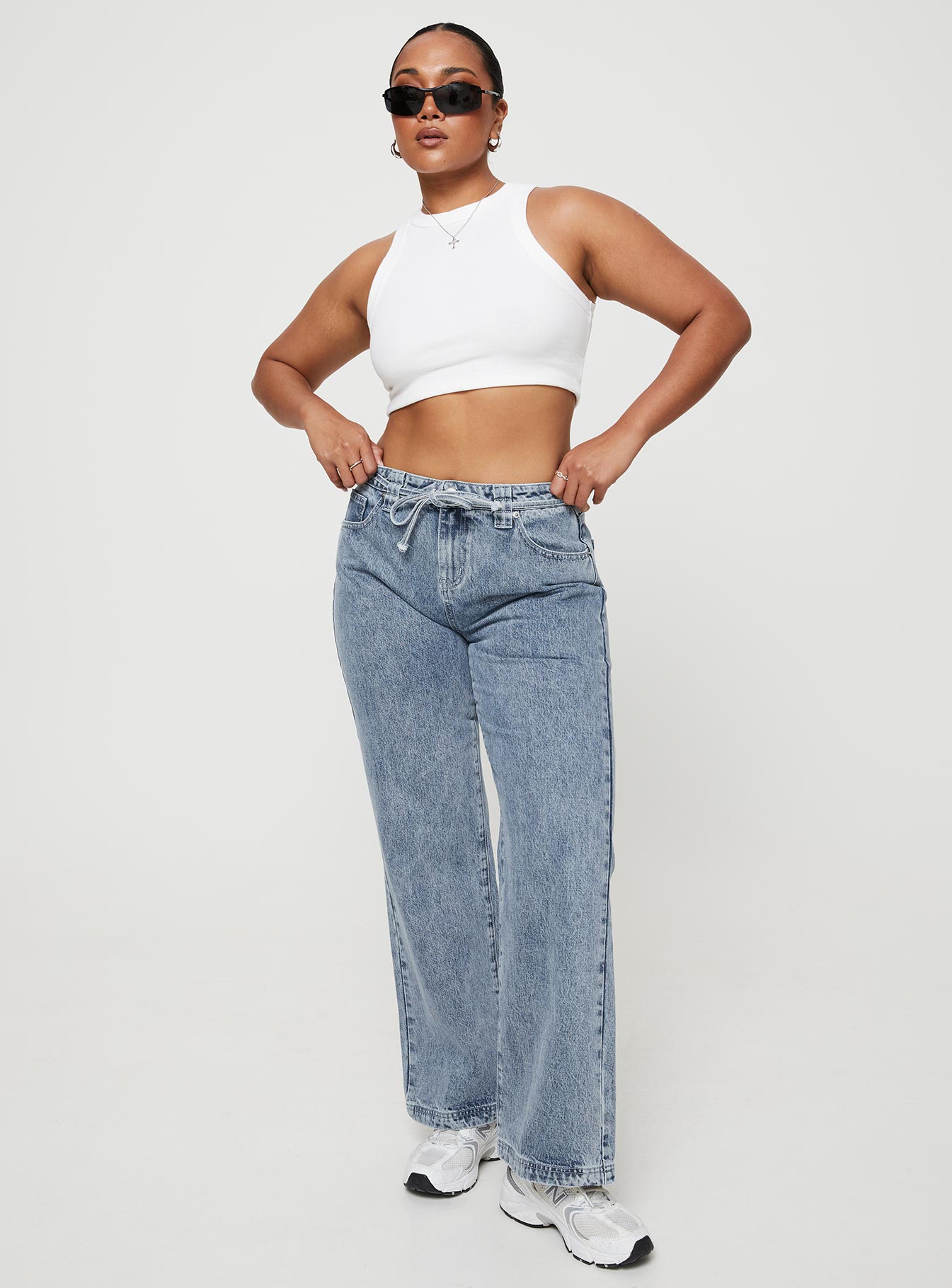 front view of model wearing Princess Polly Pemberton Jeans Mid Wash Denim Tall Mid Rise 