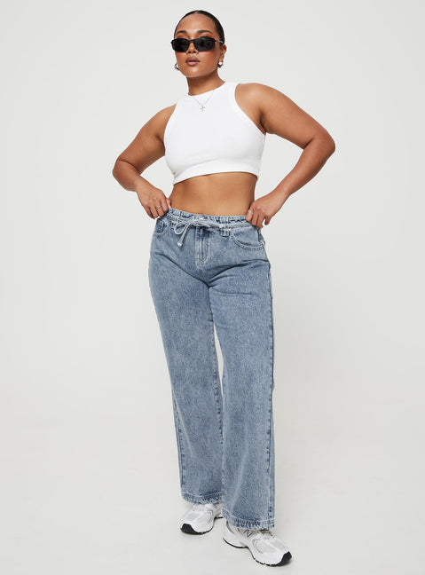 front view of model wearing Princess Polly Pemberton Jeans Mid Wash Denim Petite Mid Rise 