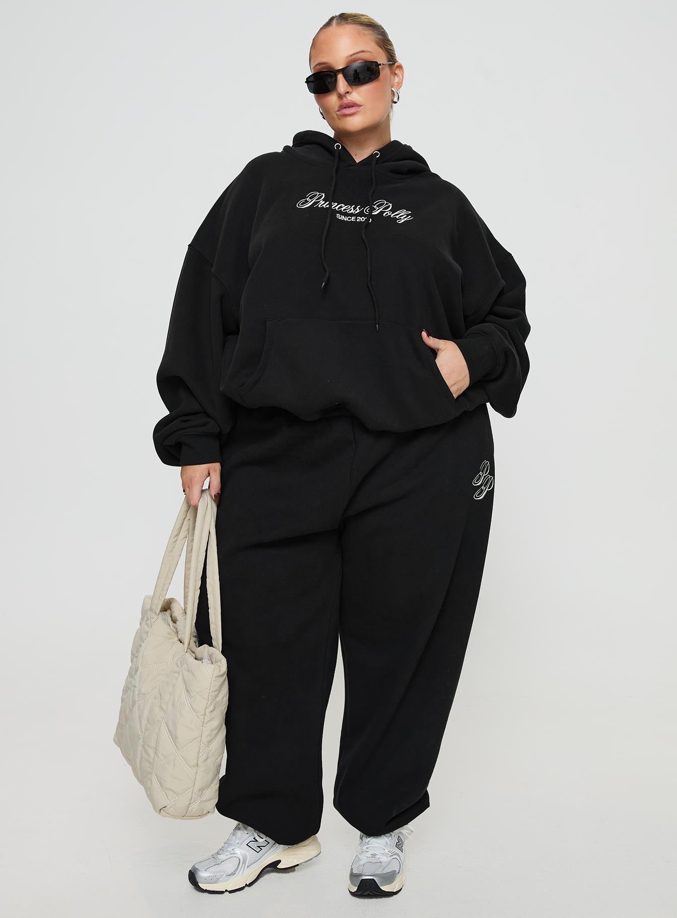 front view of model wearing Princess Polly Princess Polly Hooded Sweatshirt Script Black / Ivory Curve 