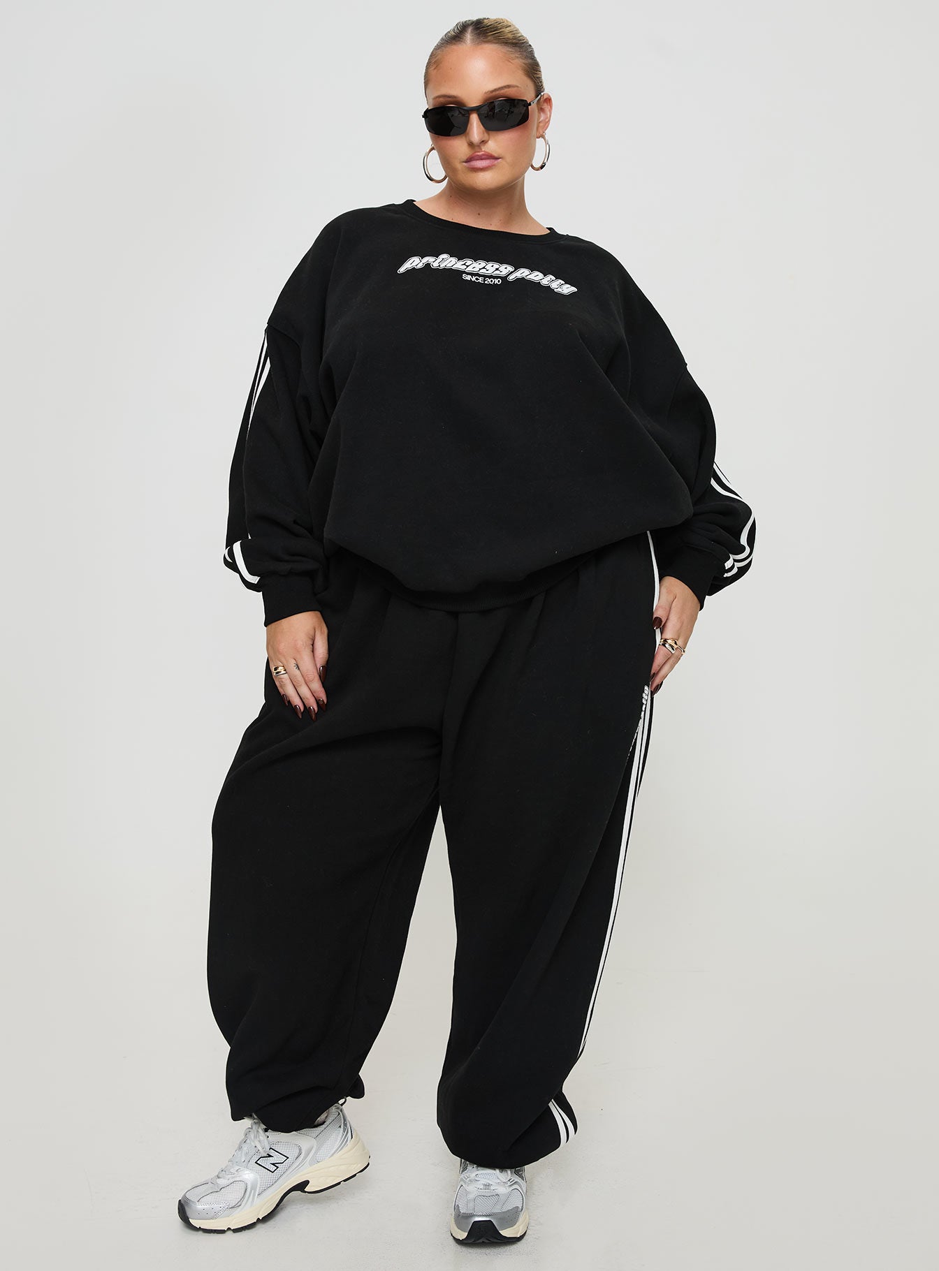 front view of model wearing Princess Polly Princess Polly Crew Neck Sweatshirt Stripe Black / White Curve 