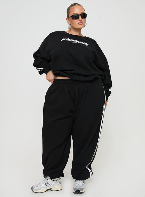 front view of model wearing Princess Polly Princess Polly Track Pants Stripe Black / White Curve High Waisted Pants 