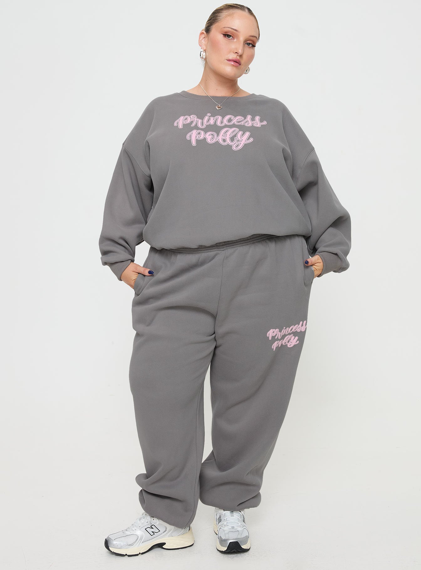 front view of model wearing Princess Polly Princess Polly Crew Neck Sweatshirt Puff Text Charcoal Curve 