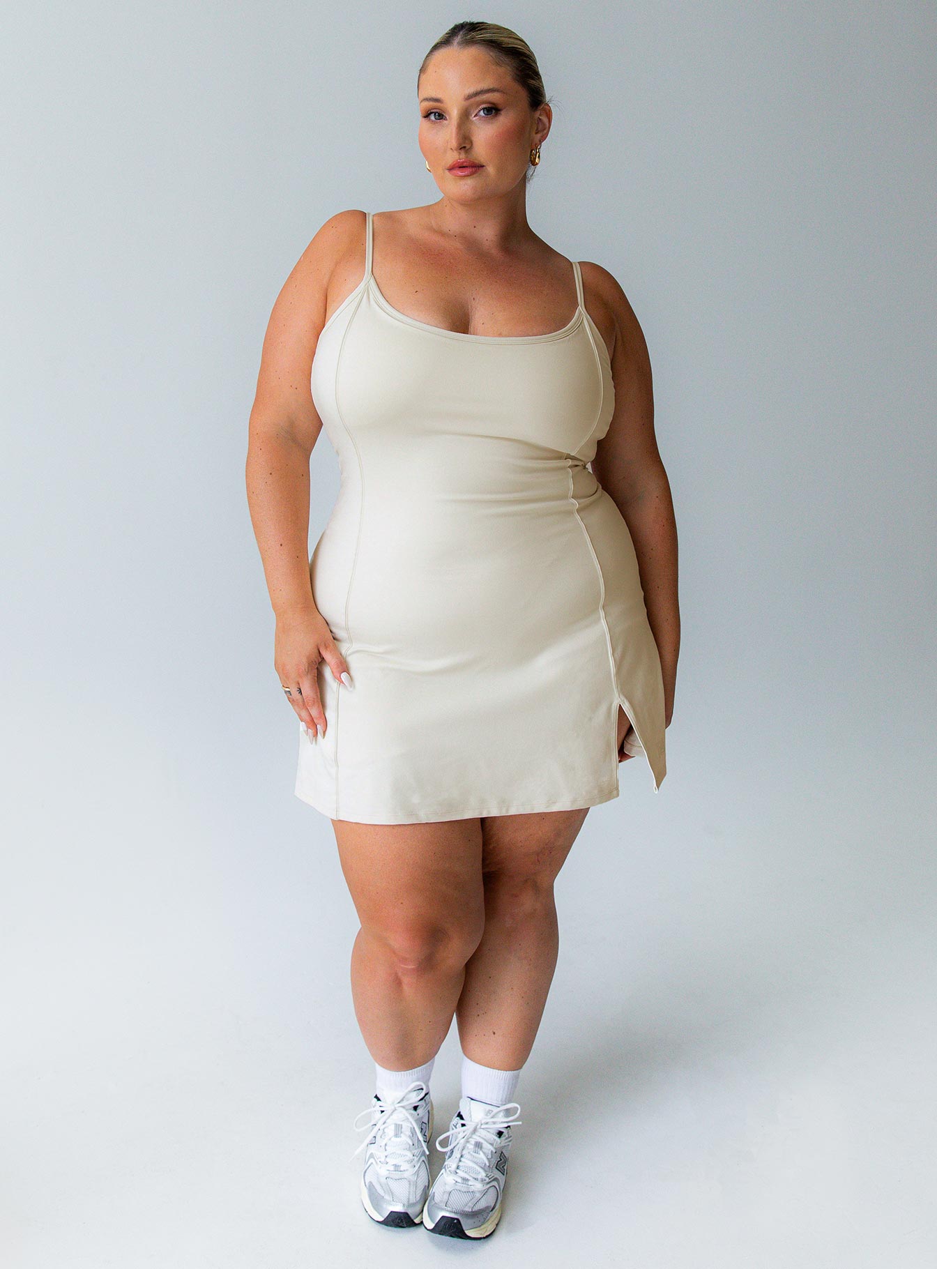 Beige activewear dress flattering scoop-neck shape that feels comfortable and unrestrictive built in shorts