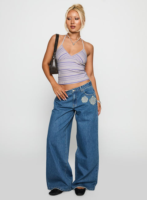 front view of model wearing Princess Polly A Keeper Flower Patch Jeans Mid Blue Low Rise Jeans 