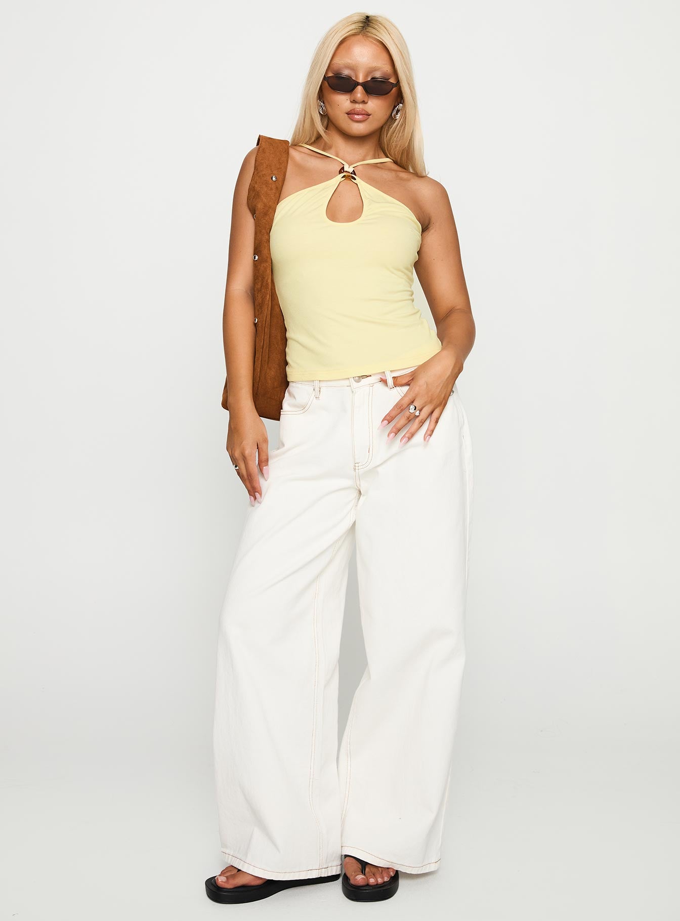 front view of model wearing Princess Polly Luminarie Cut Out Top Lemon Sleeveless Asymmetric Neckline 